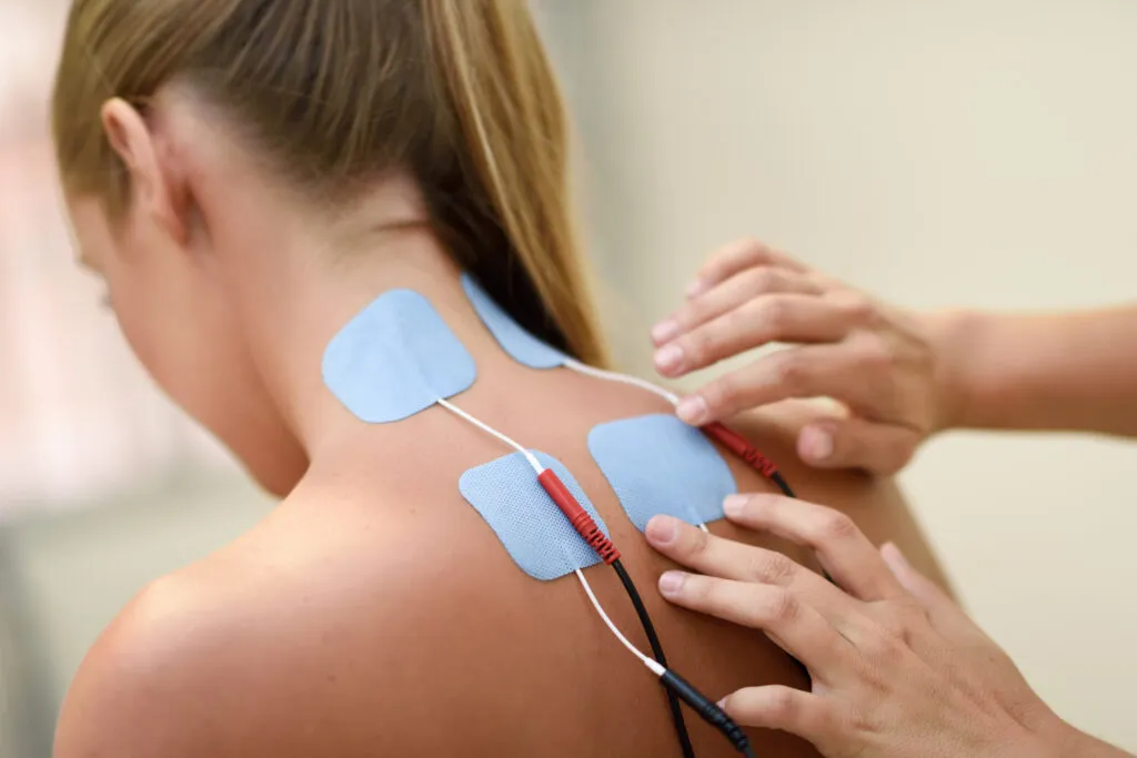 Woman receiving electrical stimulation therapy