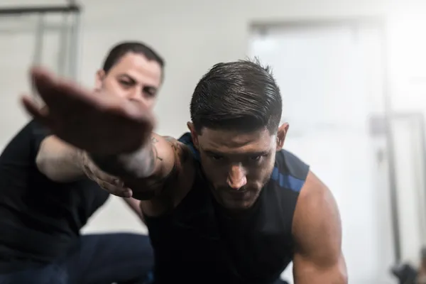 Physical therapist guiding patient through rehabilitation exercises