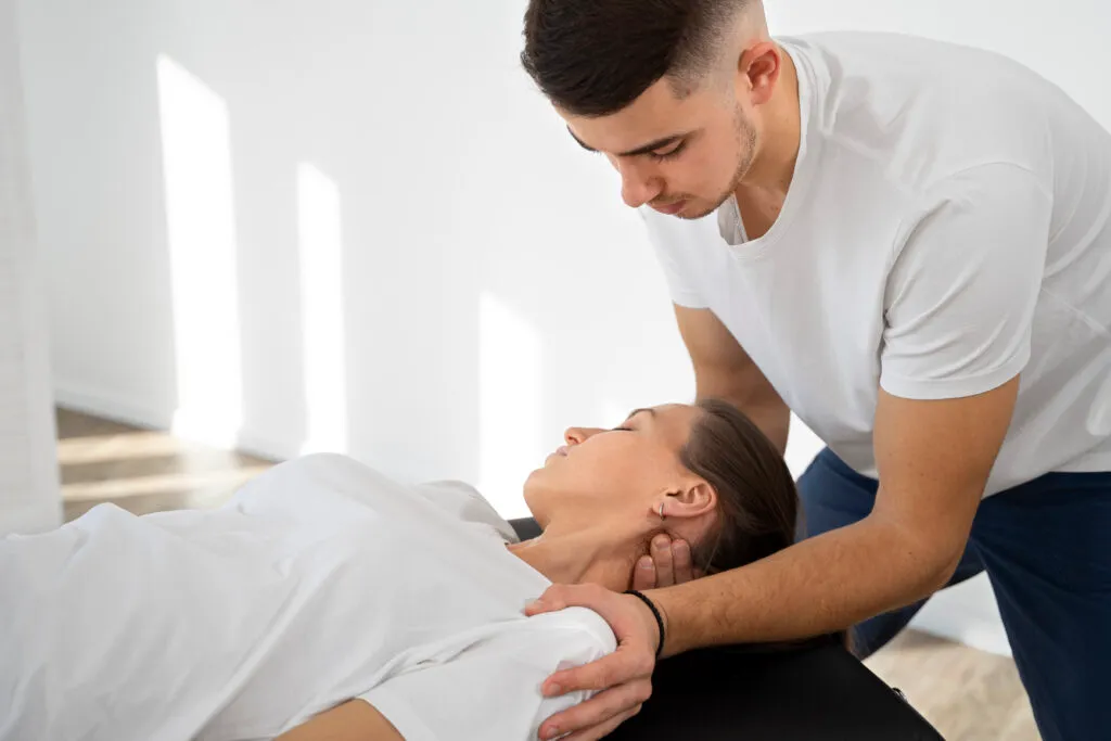 Chiropractor performing spinal mobilization therapy